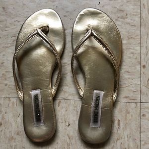 Metallic gold Steve Madden flip flops